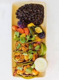 Malibu Farm signature dishes Blackened Shrimp Tacos
Vegan Coconut Curry
Vegan Chop Salad